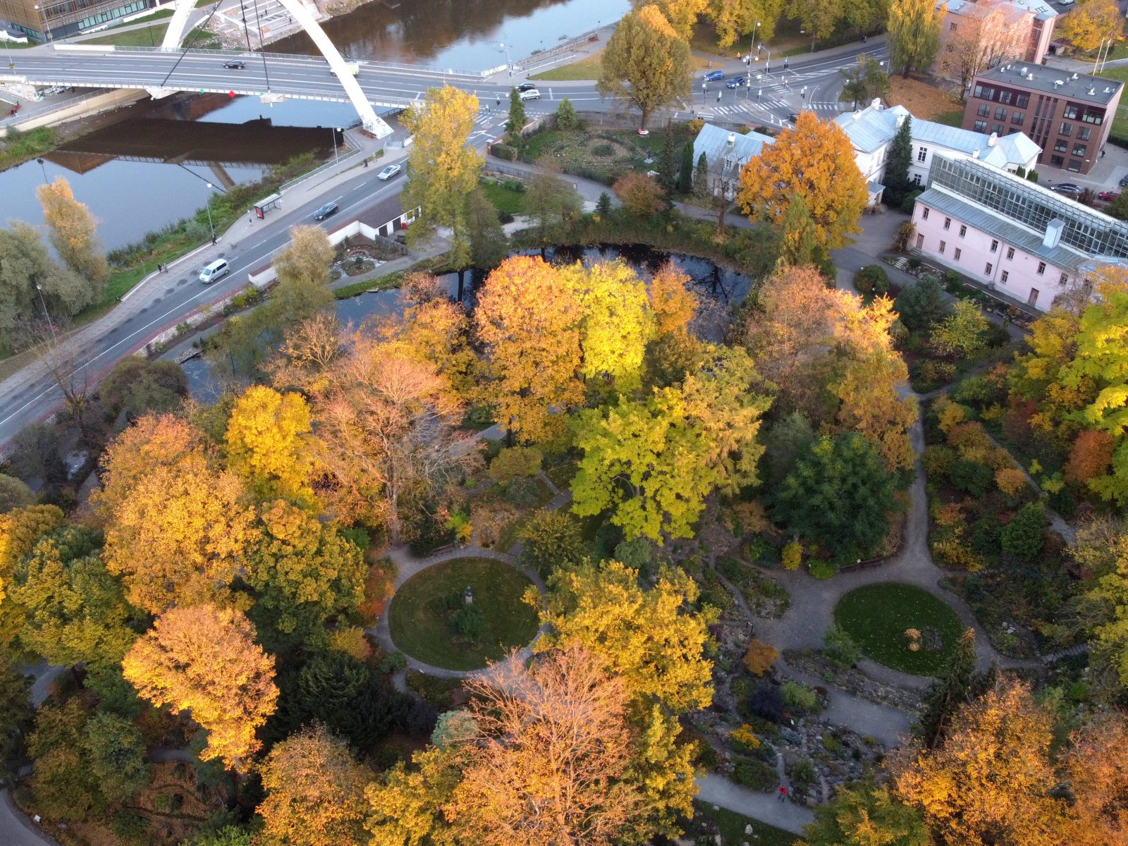 The Tartu University Botanical Garden in autumn from above, paths, trees and the river