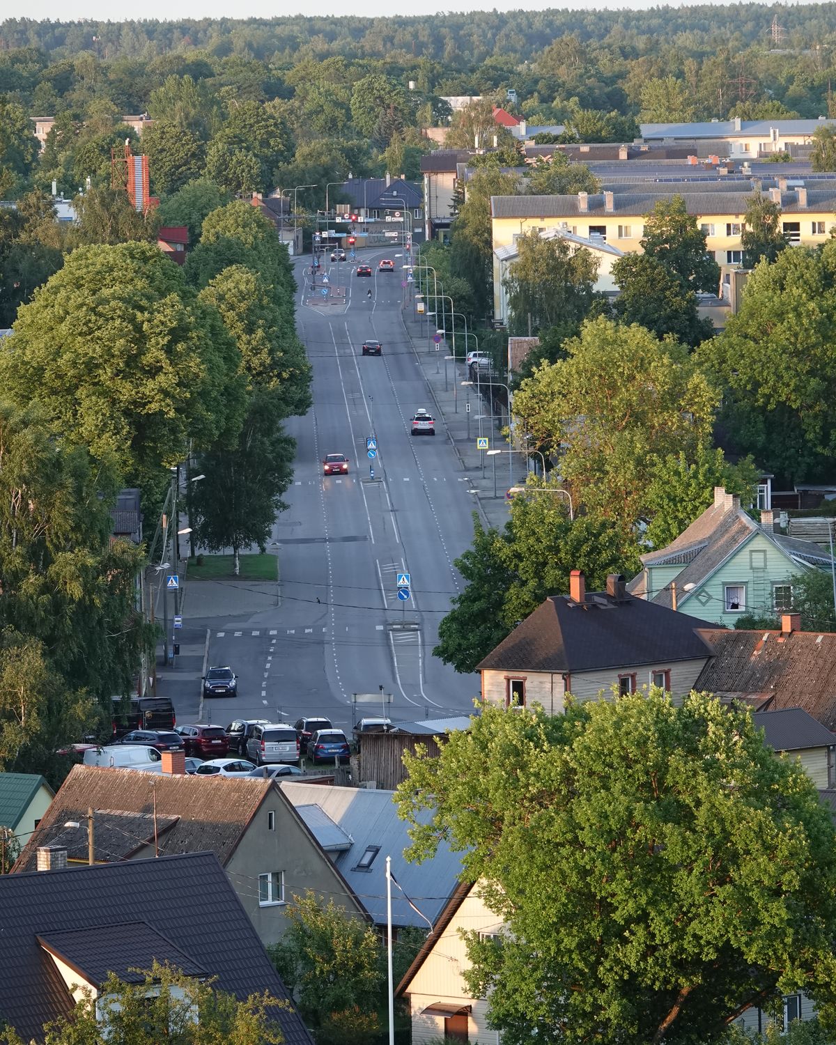 A street in Pärnu from above: houses, trees and the road into town